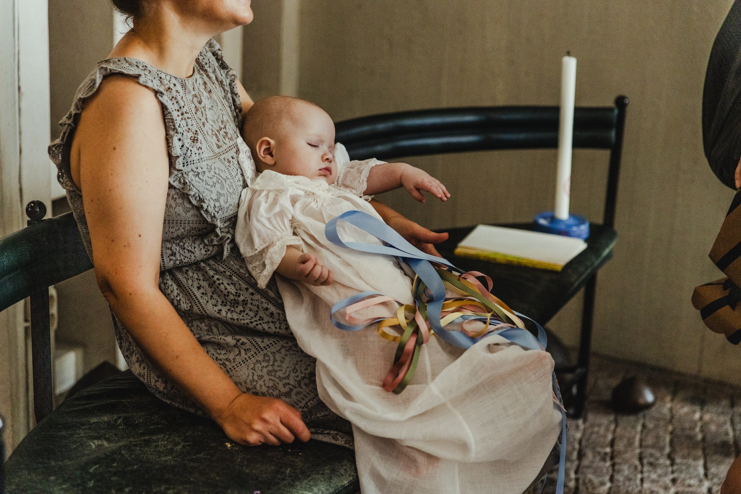 Baby resting in a family member’s arms after the ceremony.