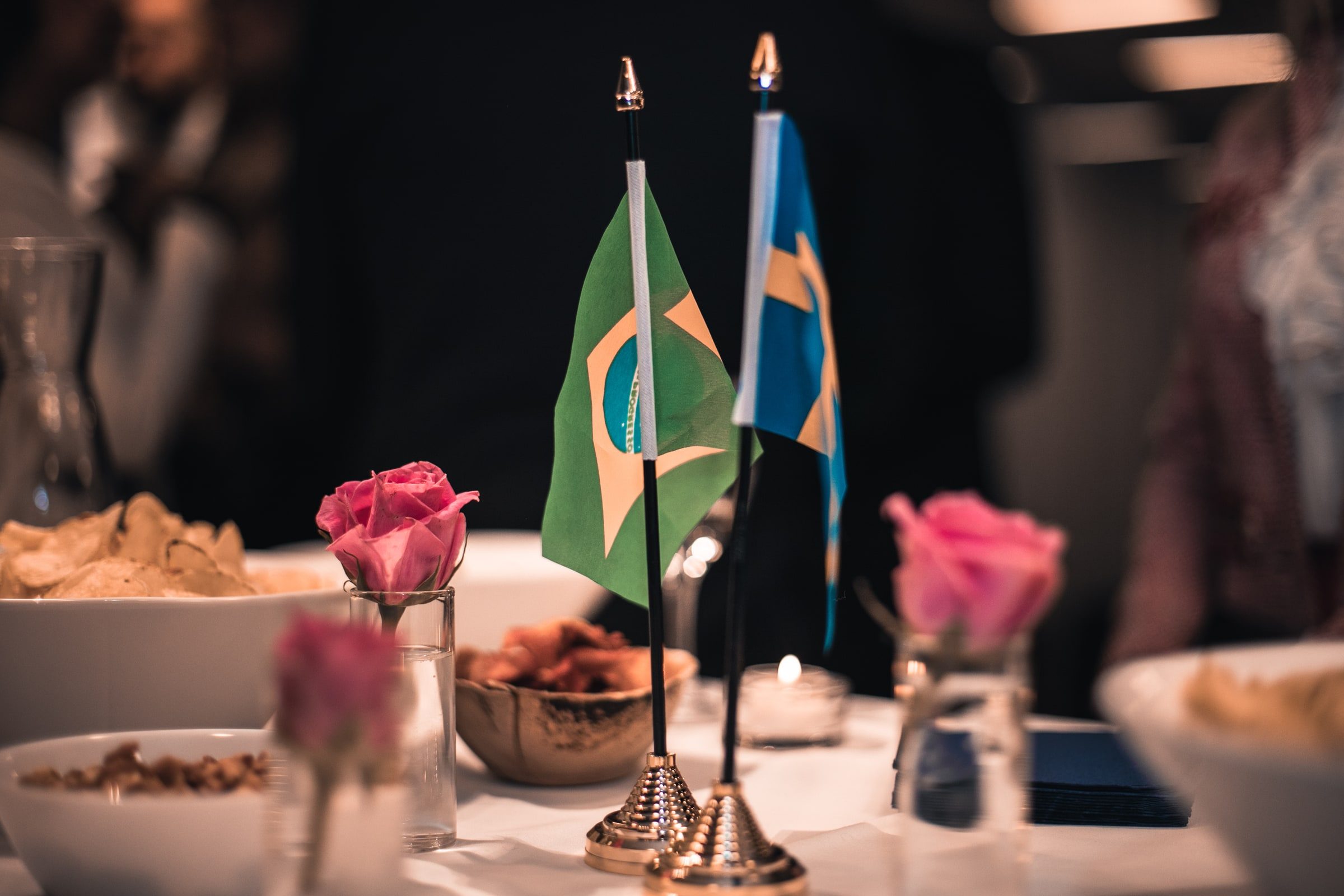 Brazilian and Swedish flags arranged on a table before the welcome reception.