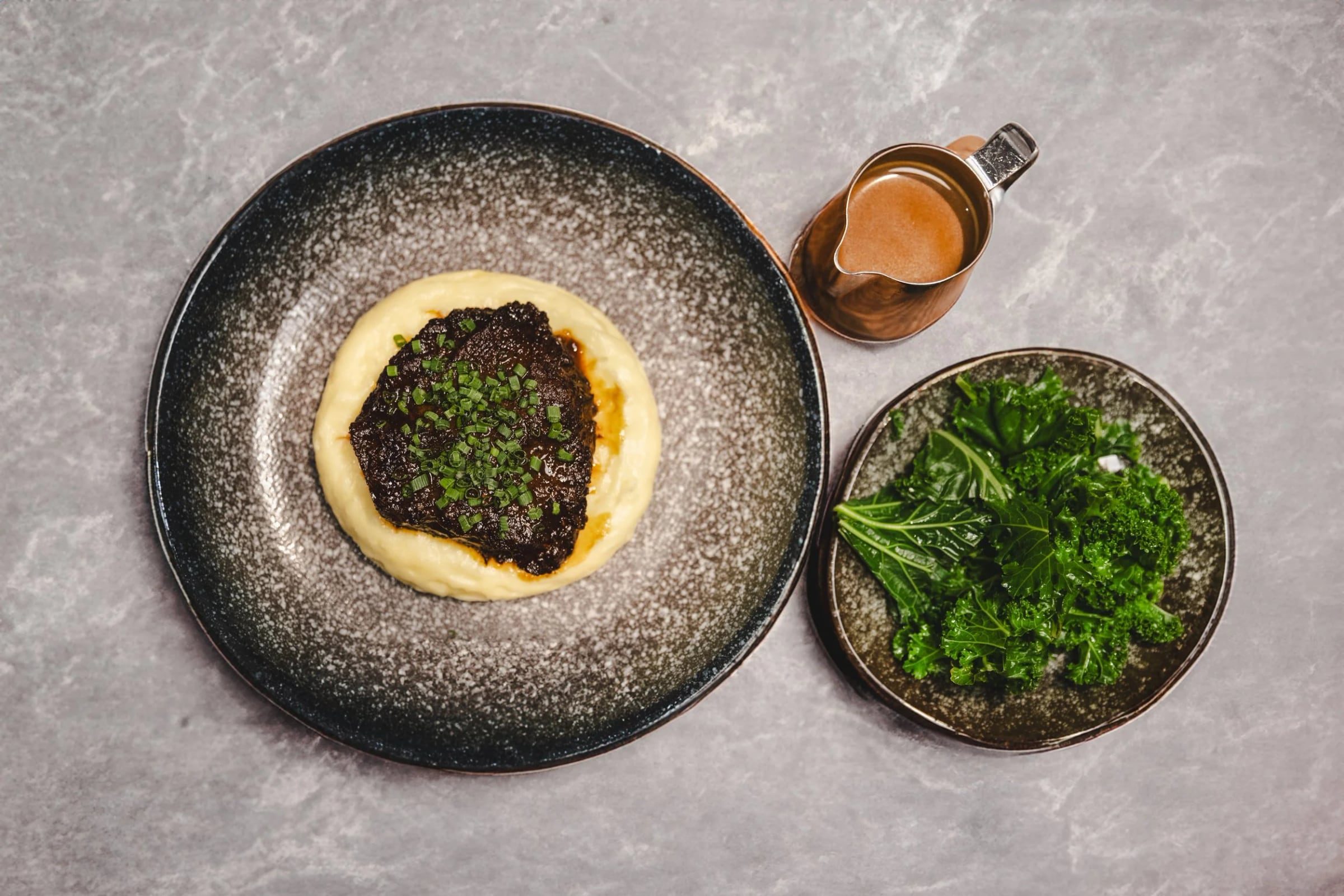 Plated starter and drinks prepared for restaurant opening guests