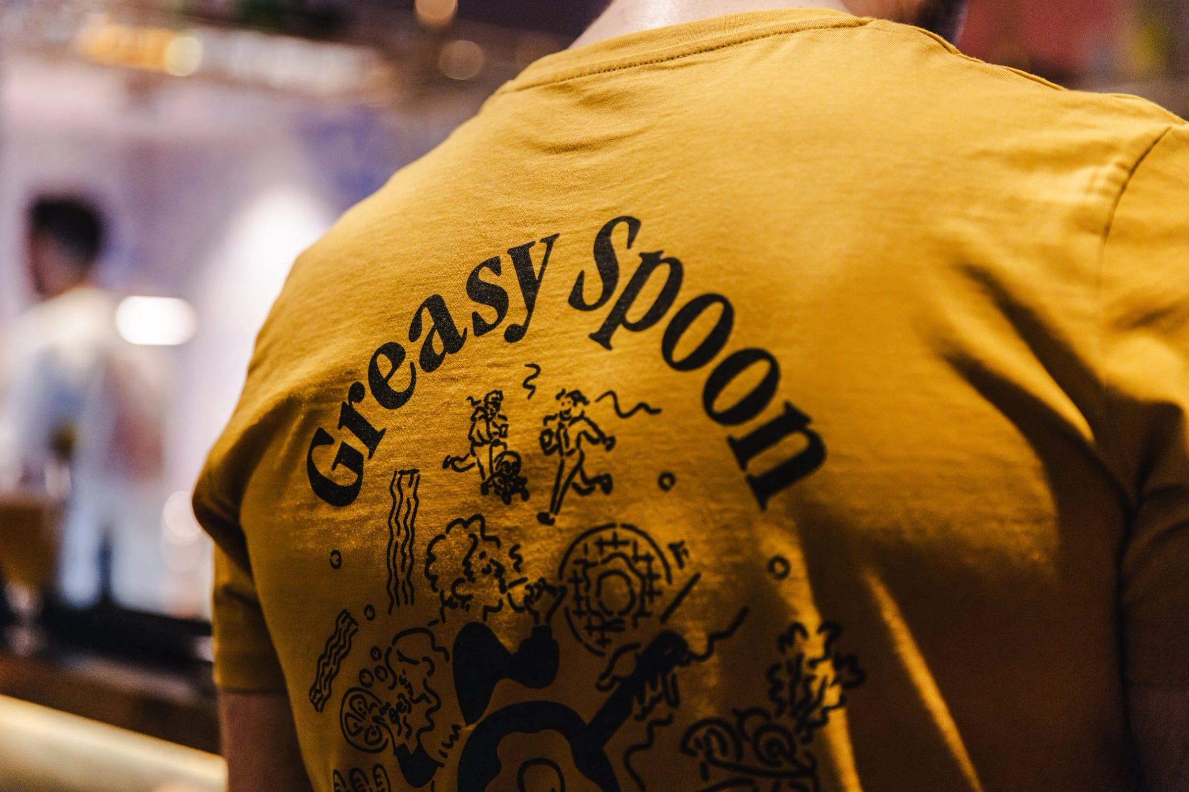 Greasy Spoon team member photographed during the soft opening