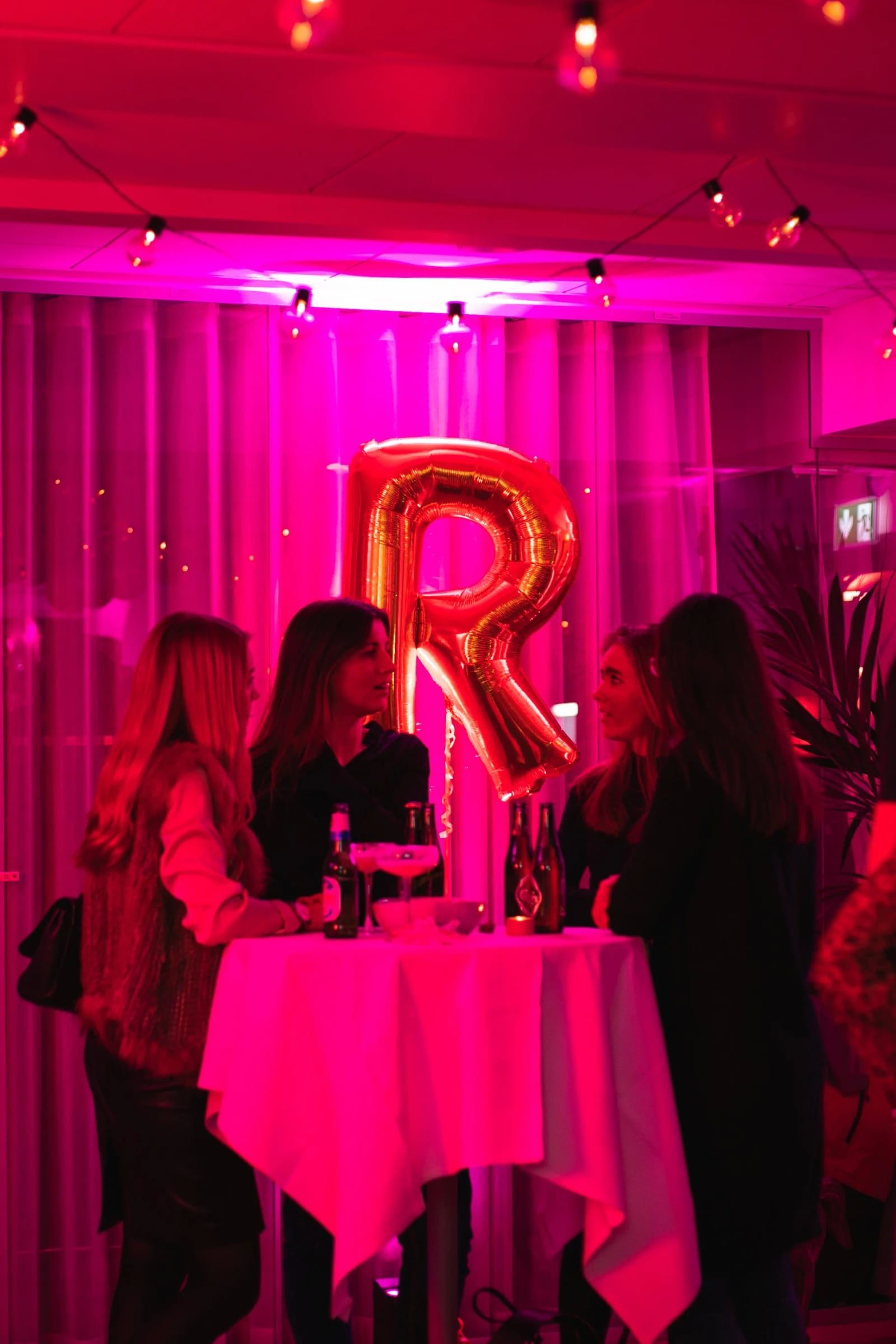 Guests gathered beneath a gold letter balloon at Relatable’s third-anniversary celebration