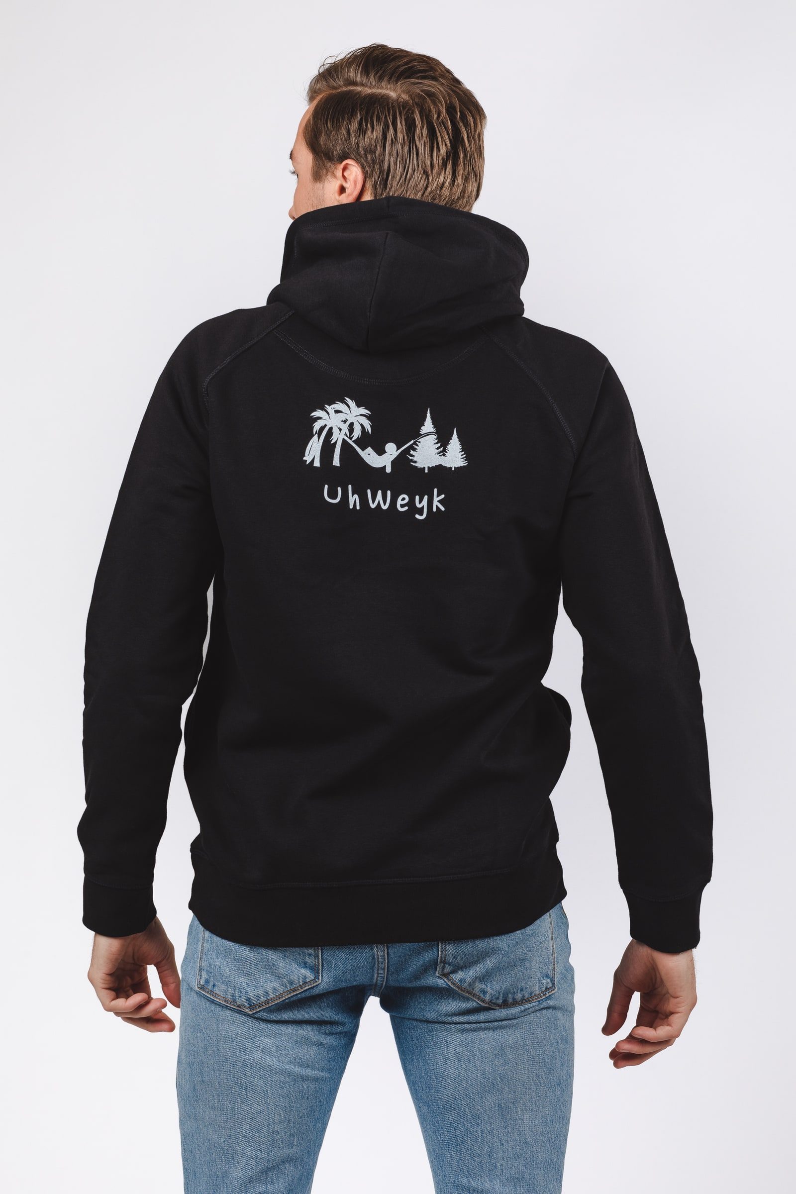Back view of a black hoodie showing the illustrated brand artwork.