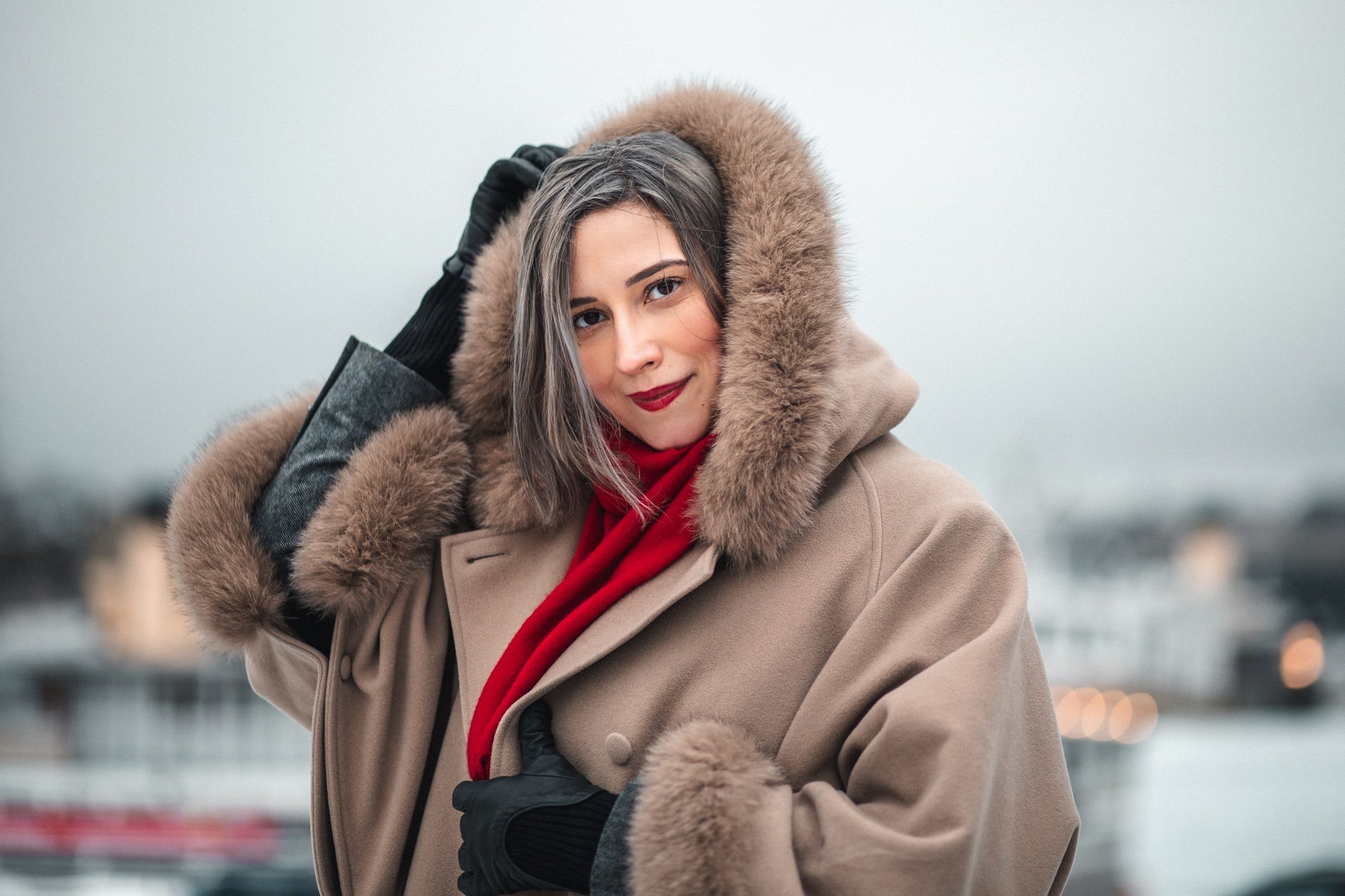 Individual outdoor portrait of a woman in a warm winter coat.