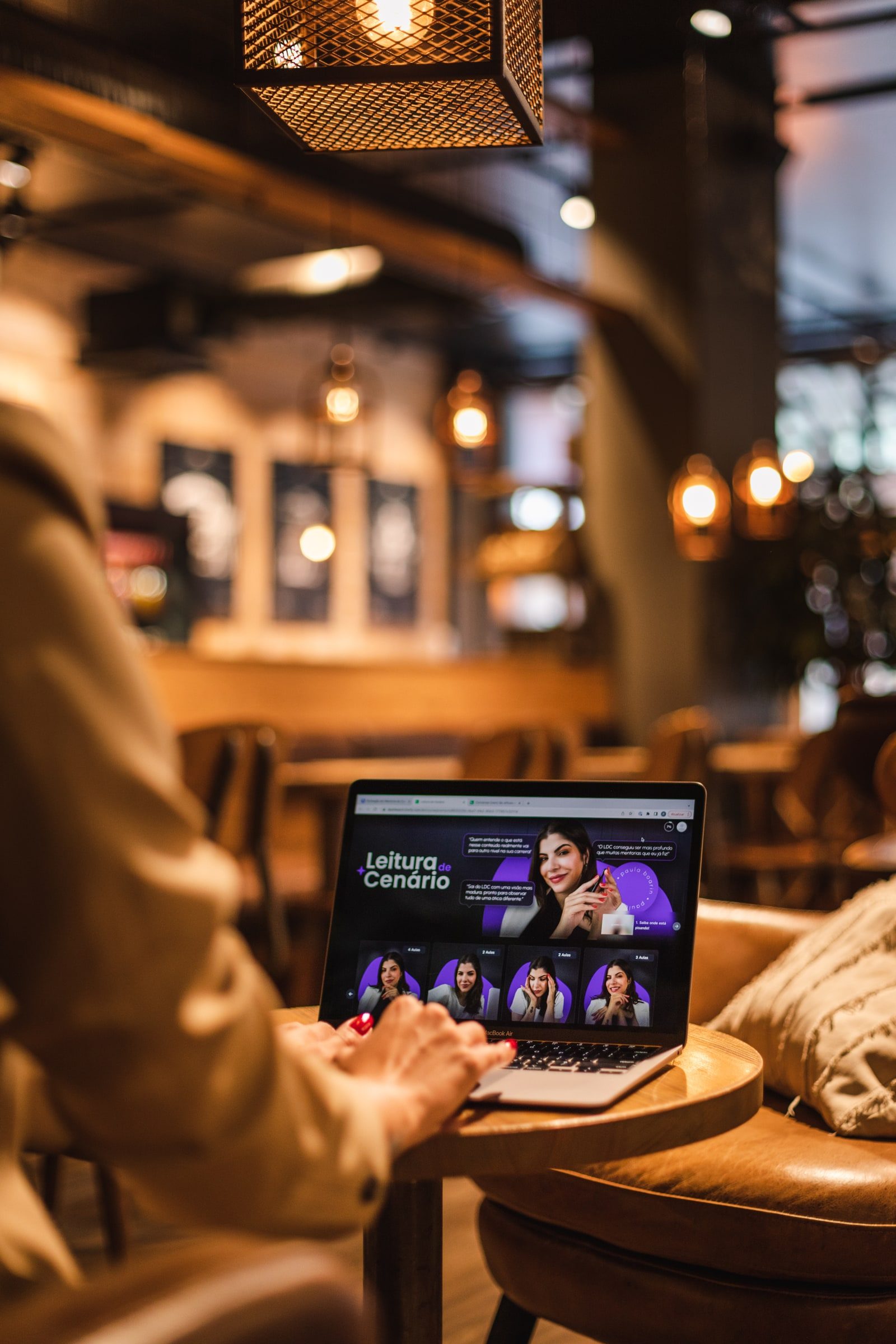 Laptop and warm café interior photographed as part of a personal branding story.