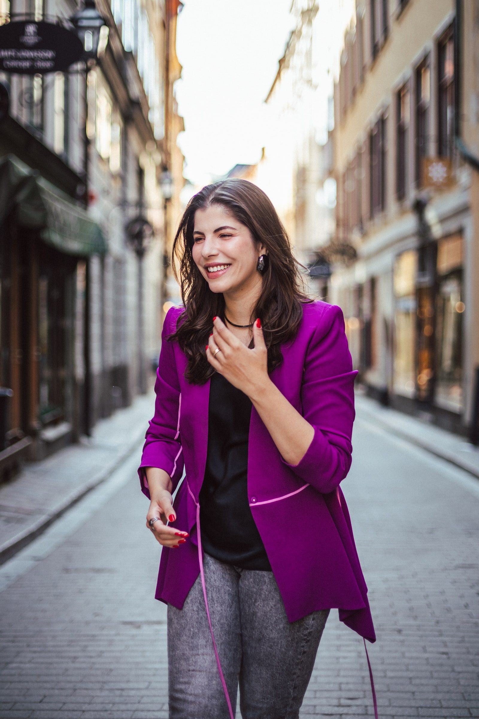 Writer smiling during an outdoor personal branding portrait session.